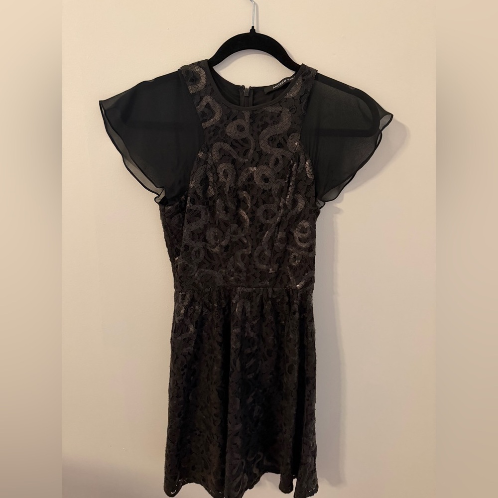 Andrew Marc black flutter sleeve cocktail dress. Size zero.